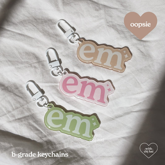 OOPSIE: em - acrylic keychain (discounted)